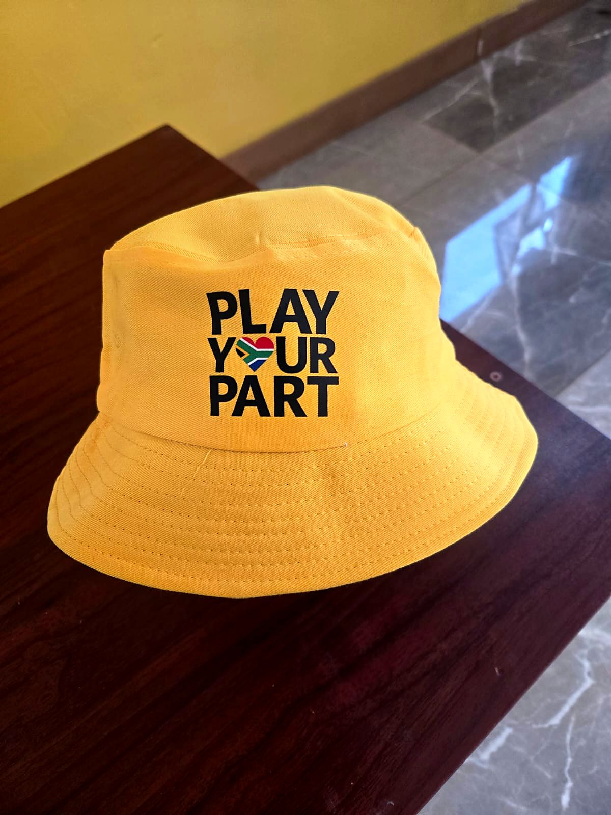 Yellow Play Your Part bucket hat