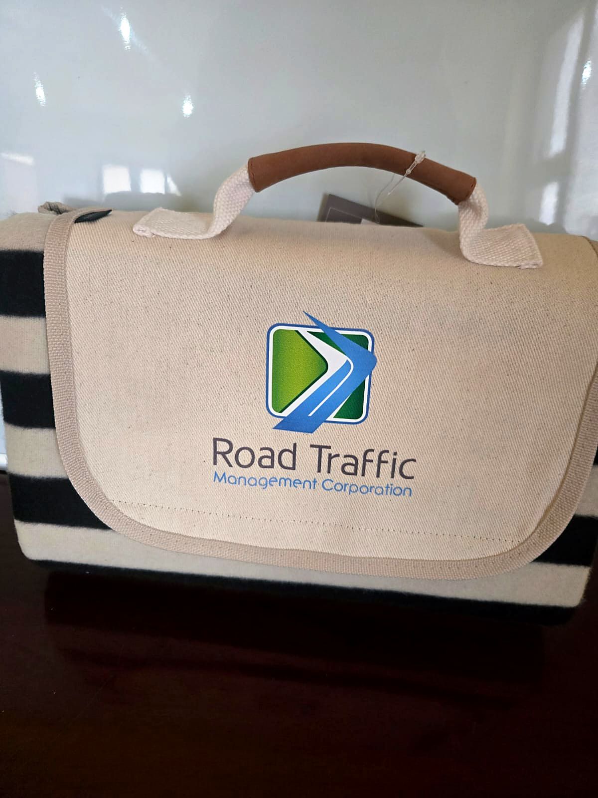 Picnic blanket with Road Traffic Management Corporation logo