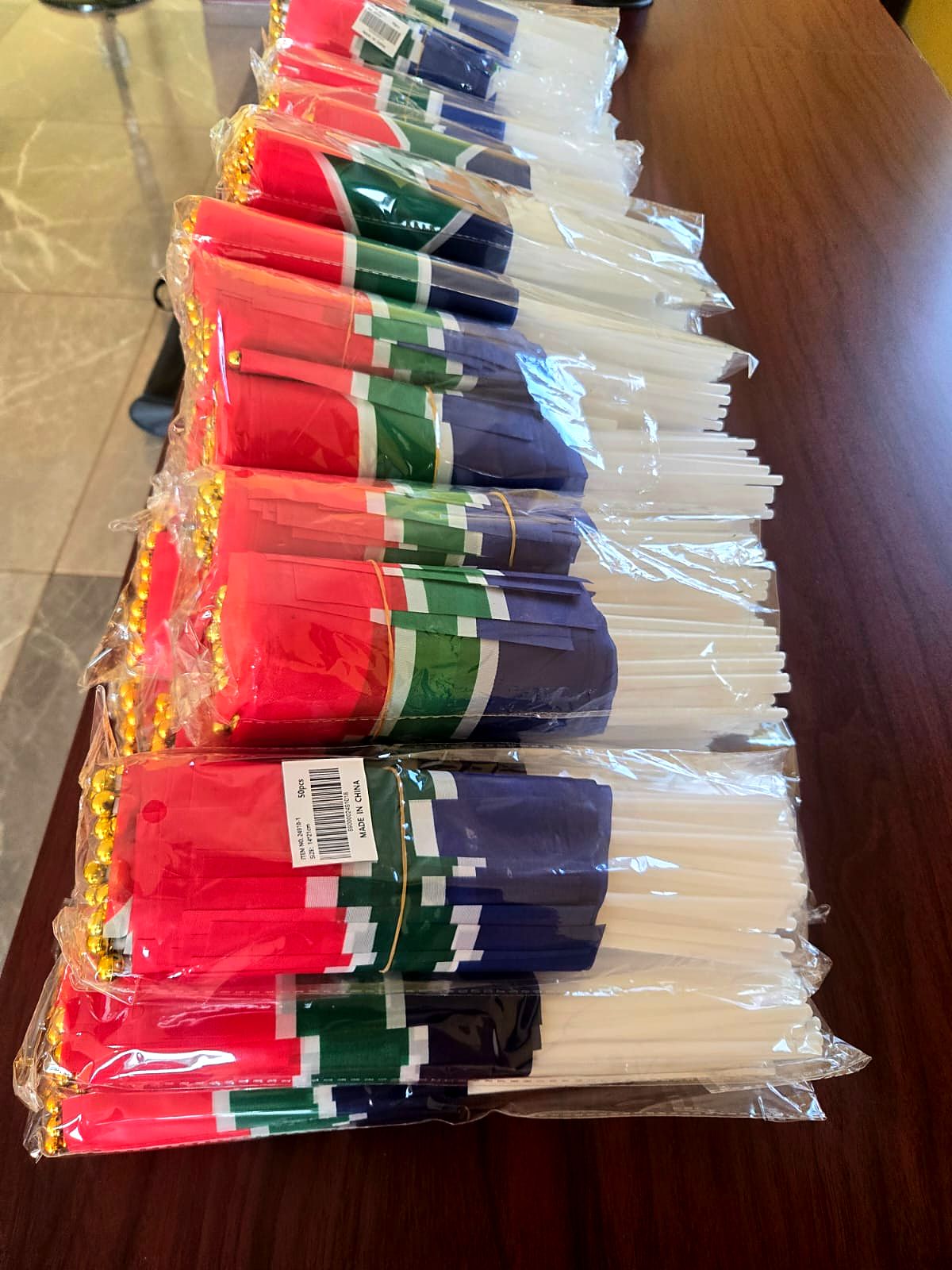 Bundles of South African hand flags in packaging